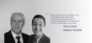 Two men in suits smile next to a quote and names.