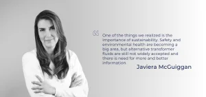 A woman with long hair poses with her arms crossed next to a quote.