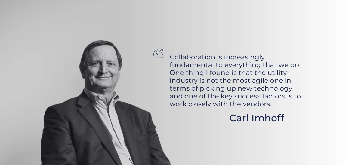 A man in a suit stands next to a quote by Carl Imhoff.