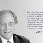 A black and white portrait of a man next to a block of text and a quote mark.