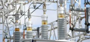 Electrical insulators stand in an outdoor substation.