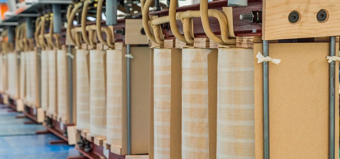 A row of wooden components connected by thick tan cables.