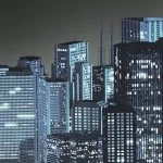 Lit skyscrapers stand against a dark sky at night.