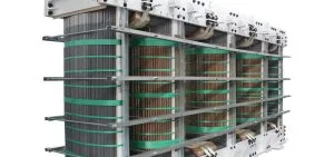 A large industrial electrical transformer with visible copper coils and metal framing.