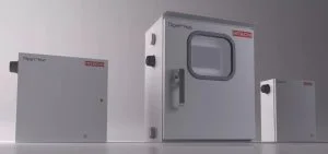 Three white Hitachi TXpert Hub boxes of different sizes stand against a gray background.