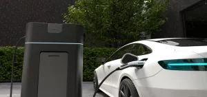 An electric vehicle is plugged into a charging station.