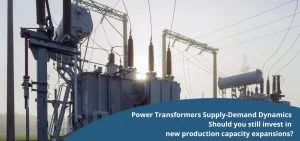 Electrical transformers and power lines stand under a bright sky.