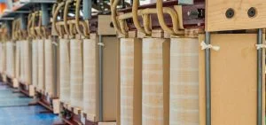 Rows of light-colored wooden panels are held in place by metal frames and tan straps.