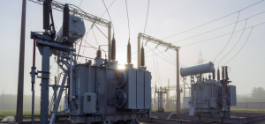 Two large power transformers with cooling radiators and high-voltage bushings at an electrical substation.