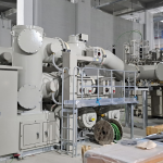 High-voltage electrical switchgear and transformer equipment at a power substation.