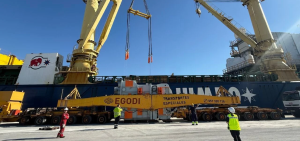 Heavy-lift vessel cranes and specialized transport equipment at the Port of Motril during Hitachi Energy's 425 MVA transformer export operation.
